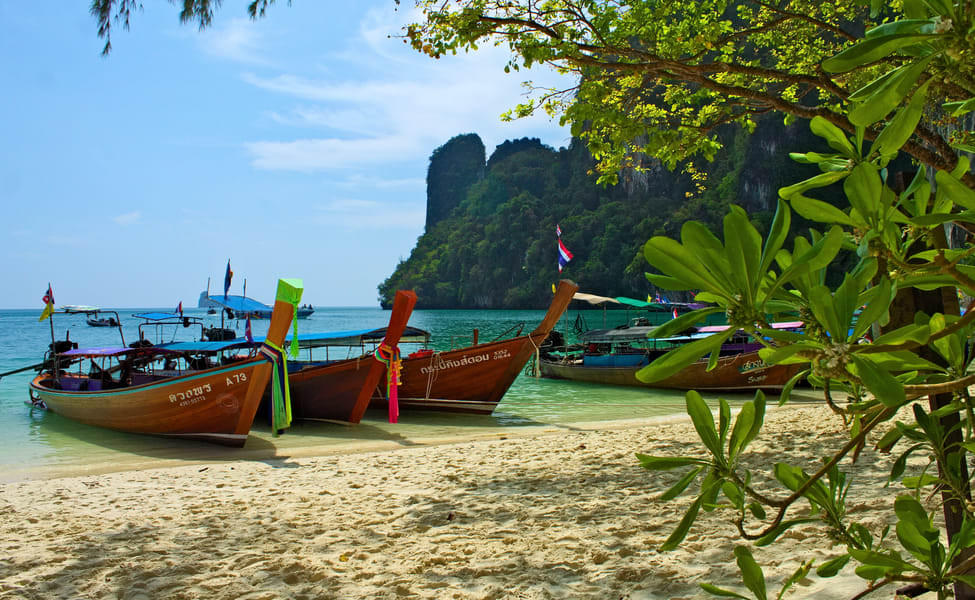 Traditional Thai longtail boat transfers will take you on a charming journey