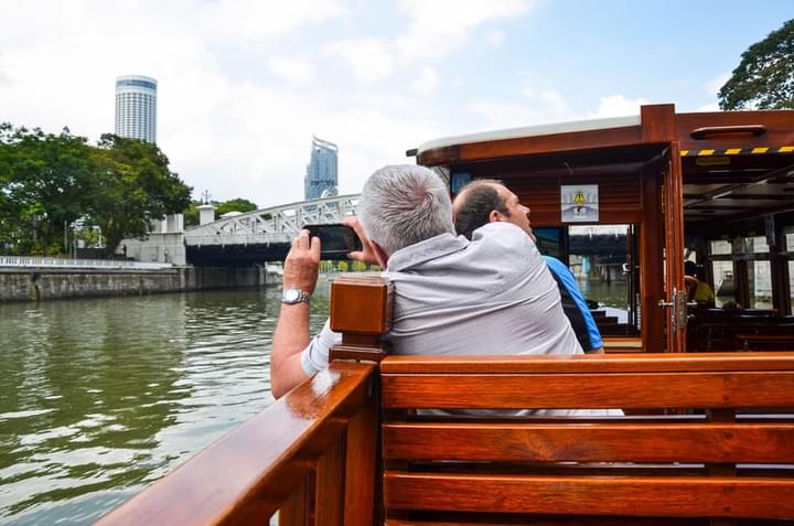 People enjoying Singapore River Cruise