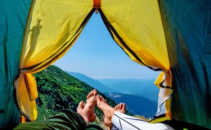 Trekker resting in sleeping bag