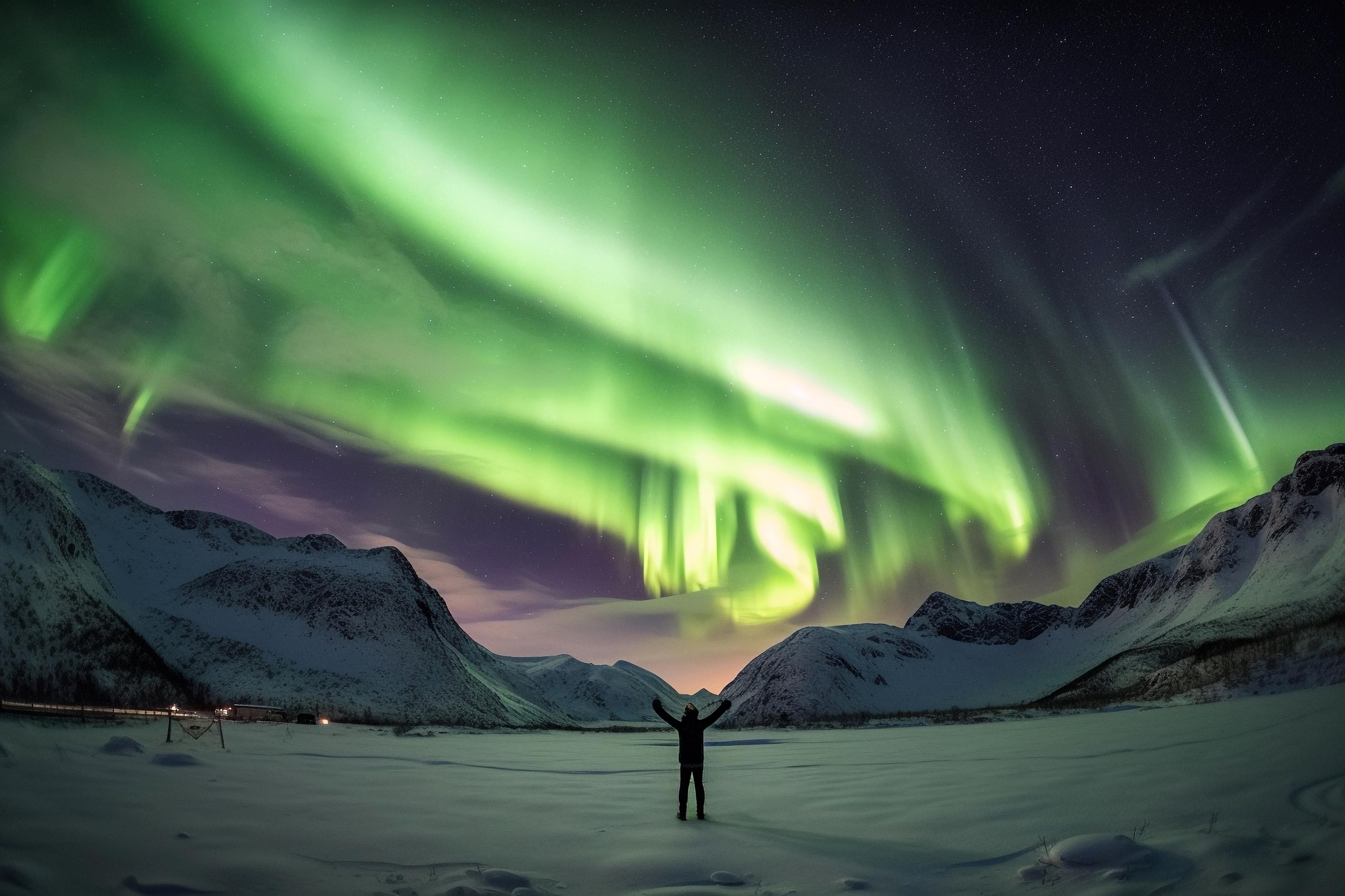 Tourist admiring the view of Northern Lights