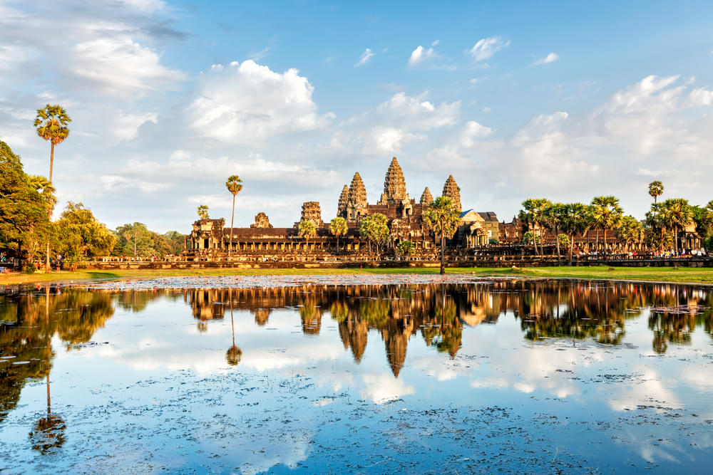 Angkor Wat with its reflection in water during sunset, Siem Reap