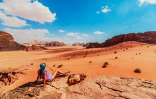 Admire the vast desert landscapes of Wadi Rum
