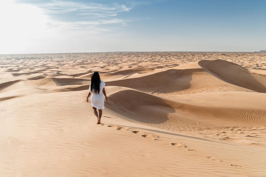 Traveler enjoying a leisurely walk through the Dubai deserts