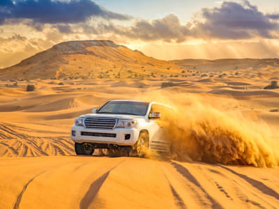 Feel the thrill of dune bashing as you conquer the golden sand dunes of the Arabian Desert