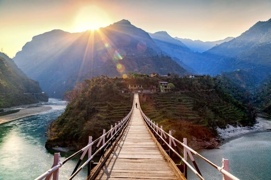 Take a walk across the hanging bridge while admiring the breathtaking mountains that surround the Beas River.