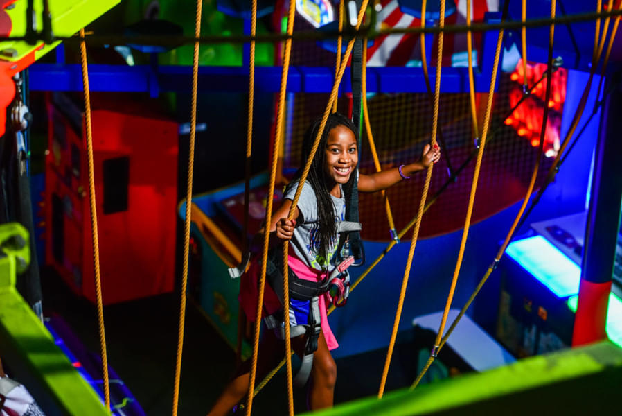 Test your balancing skills as you walk the Indoor Ropes Course