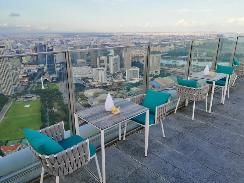 Sit on the 63rd floor of the building and admire the scenic beauty of the city