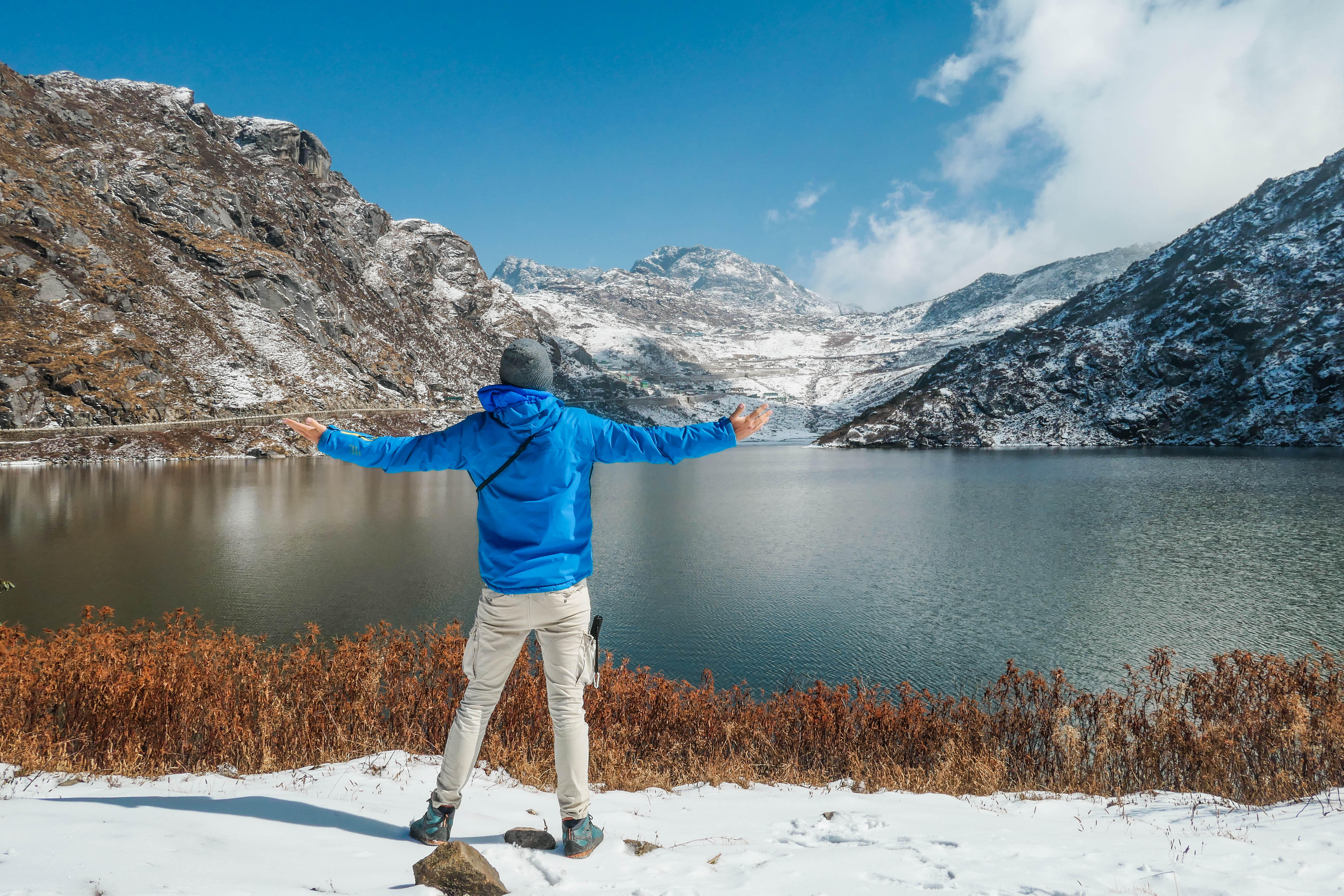 Marvel at the stunning beauty of Tsomgo Lake, surrounded by snow-capped peaks