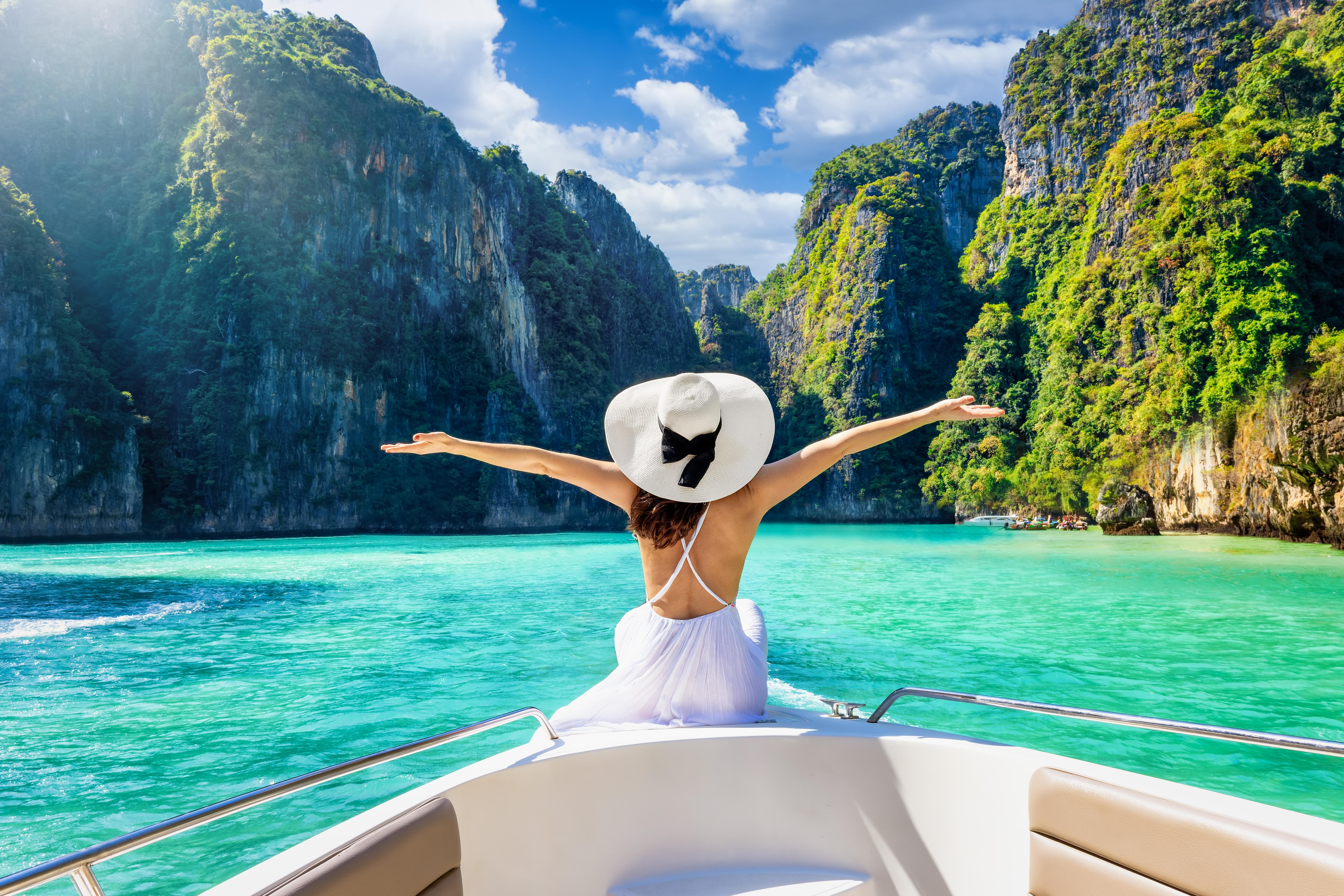 Tourist enjoying the scenic view from speed boat