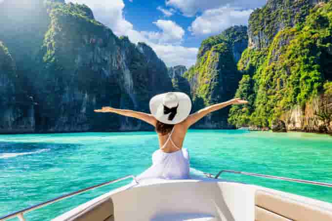 Tourist enjoying the scenic view from speed boat