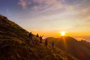 Tourists enjoying sunrise at Fansipan Mountain