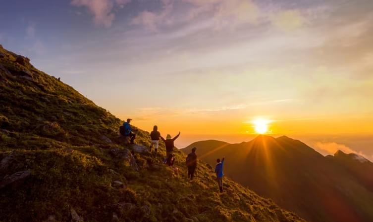 Tourists enjoying sunrise at Fansipan Mountain