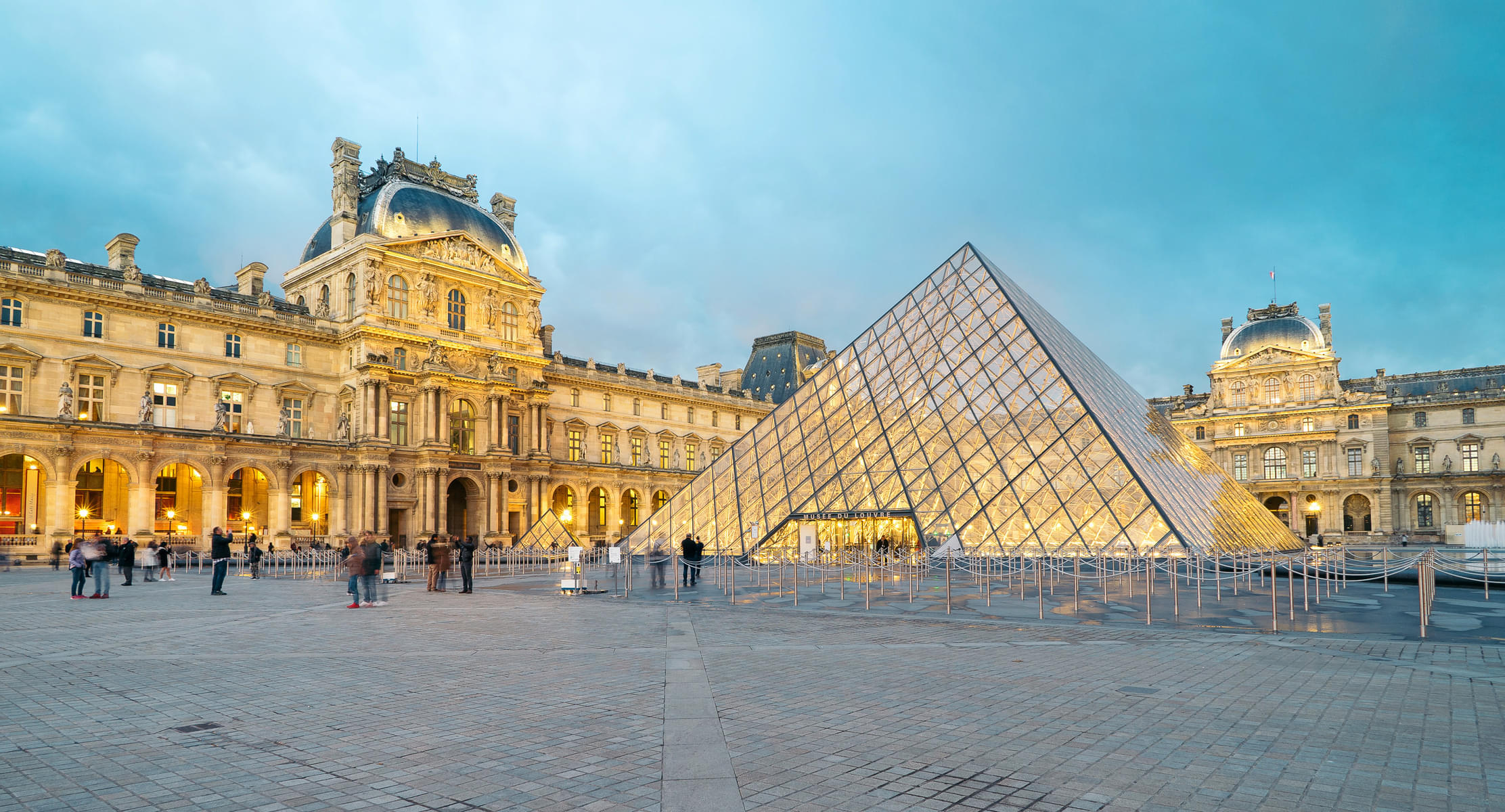 Take a look at the Louvre Pyramid, a striking symbol of artistic legacy and innovation
