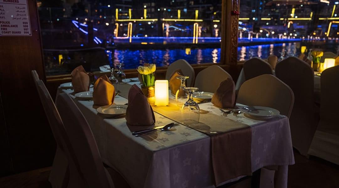 Settle into an enchanting dinner setting on the Dhow
