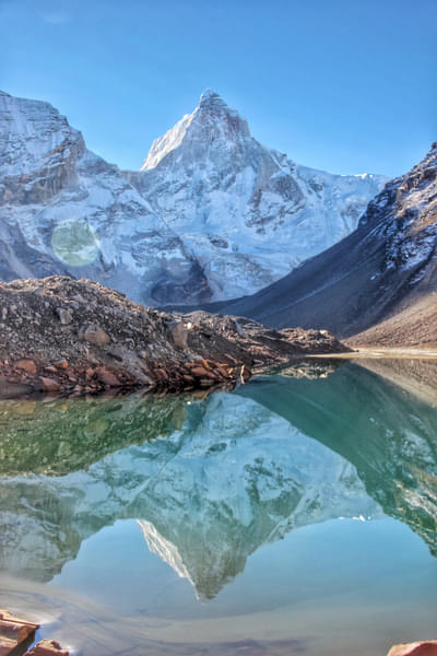  a glacial lake, sitting amid a cauldron of big mountains.