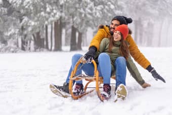 Couple enjoying in the snow