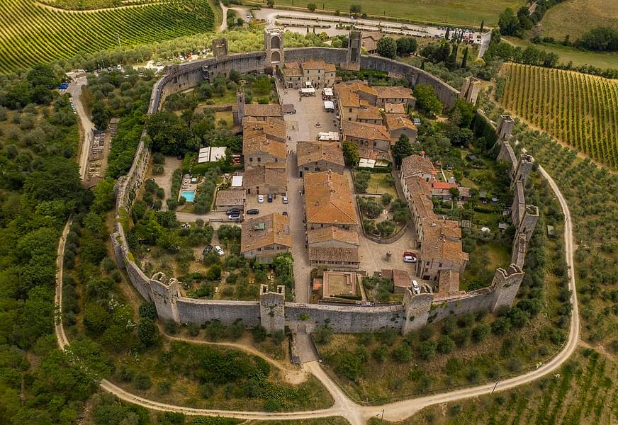 Travel to the walled city of Monteriggioni.