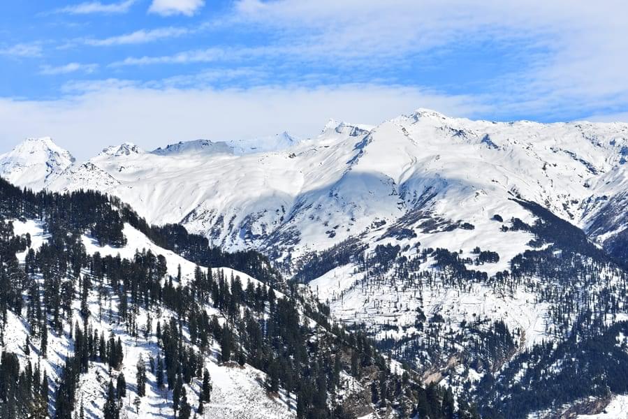 Embrace the serene beauty of the snow-capped peaks as you ski at Solang Valley.