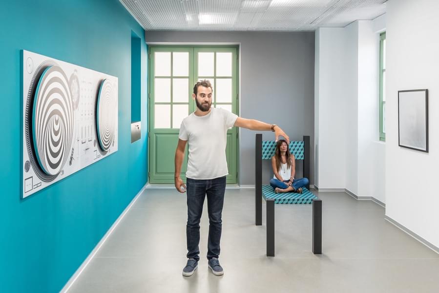 See the miniature form of your folks in Ames Room