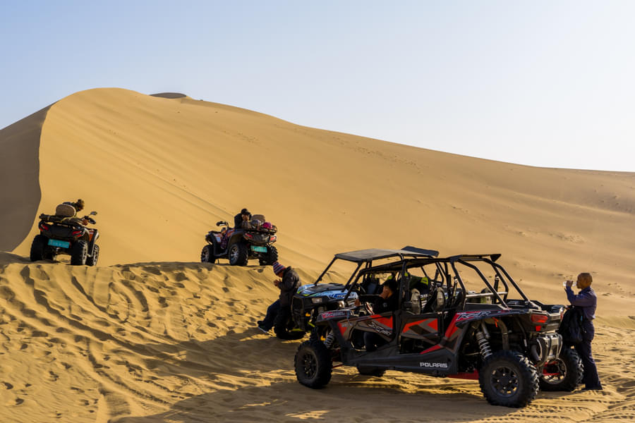 Ride dune buggy in golden sand