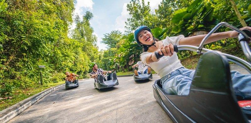skyline-luge-sentosa_a-lady-laughs-as-she-races-her-friends.jpg