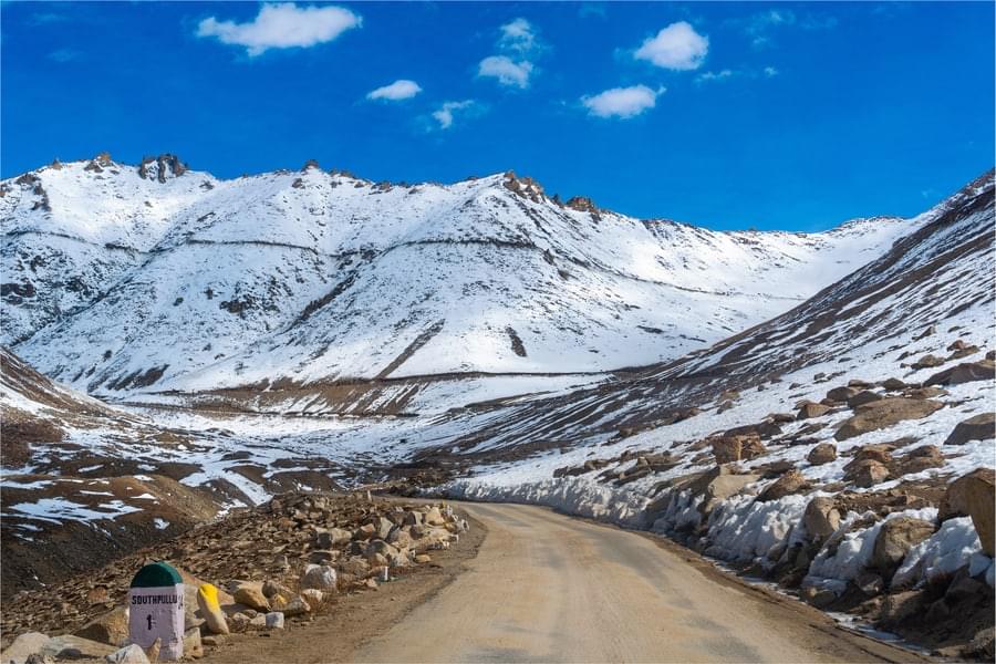 Drive uphill through the spectacular snow covered peaks