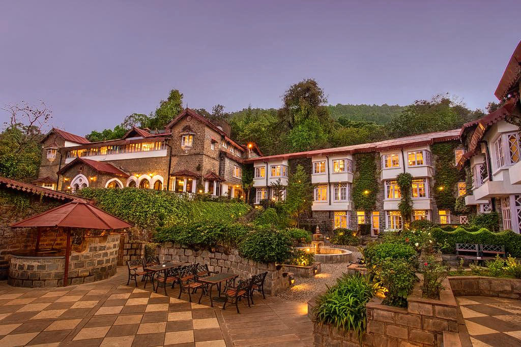 Exterior view of the resort with mountain backdrop