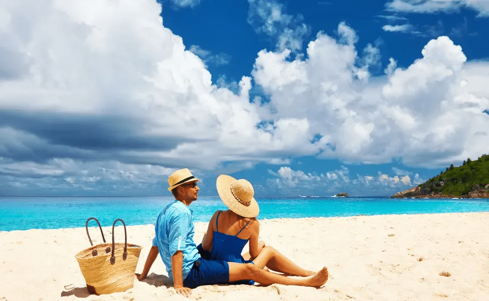 Couple at Seychelles enjoying Sun at the beach  