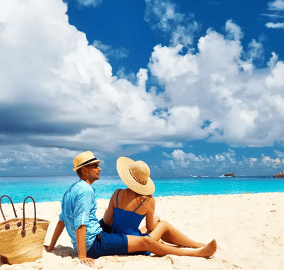 Couple at Seychelles enjoying Sun at the beach