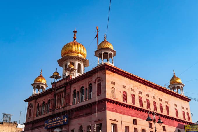 Marvel at its gleaming domes and peaceful atmosphere in a lively street setting