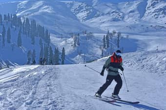 Glide down the slopes of Gulmarg surrounded by breathtaking mountain views
