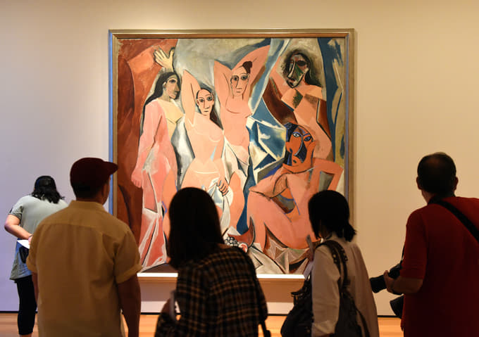 Art lovers observing one of the most popular art pieces of the Picasso Museum, Barcelona