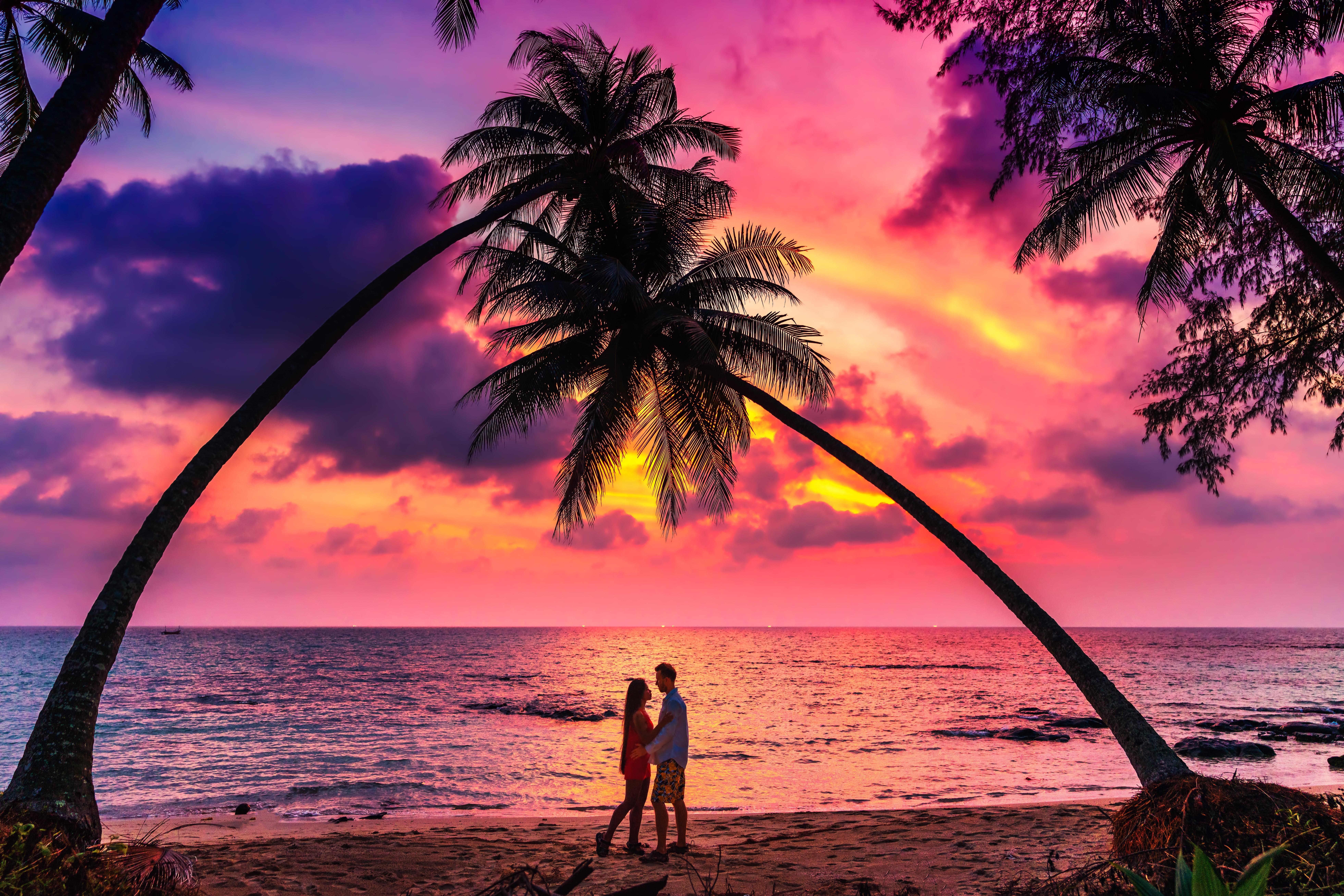 Silhouette of affectionate couple at sunset, Mauritius