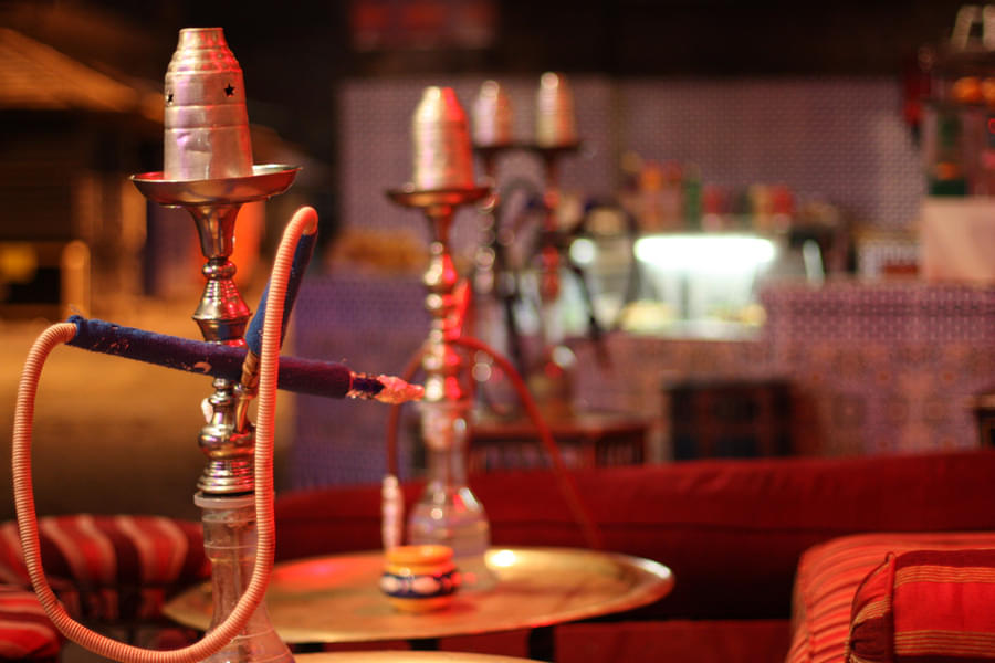 Indulge in the traditional Middle Eastern custom of smoking shisha and relax in style