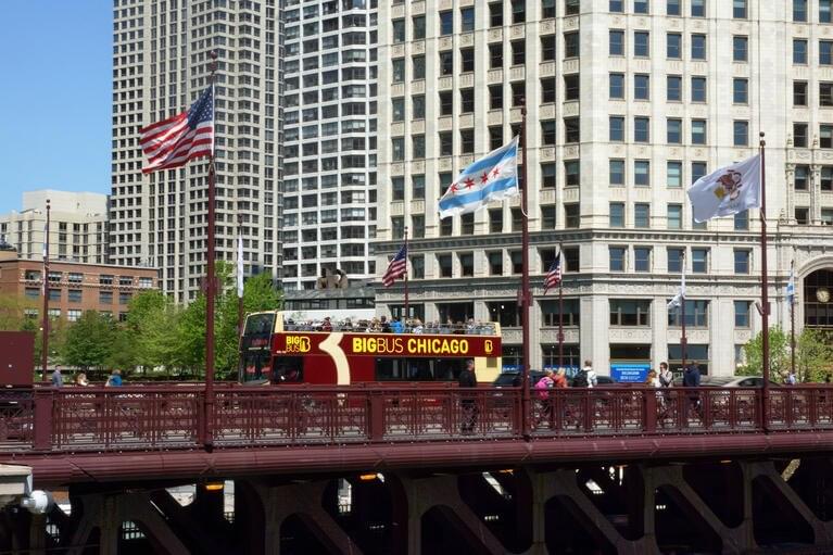 Travel across the Michigan Avenue Bridge over the Chicago River
