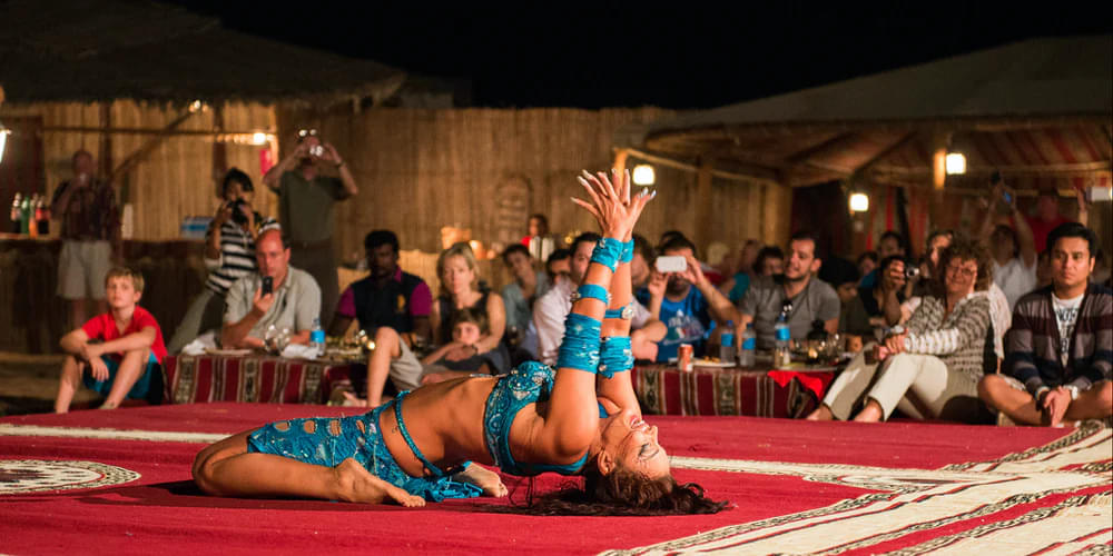 Enjoy cultural performance like belly dance at the campsite