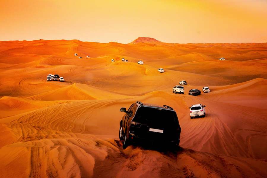 Highlights Of 15-Min Helicopter Tour of Dubai & Red Dunes Desert Safari with Bedouin Camp Experience