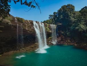 The Shimmering Blue Water of Krang Suri Waterfall