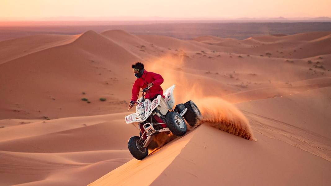 Go quad biking around the desert by following your guide.
