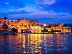 Stunning golden hues of City Palace and Pichola lake in Udaipur, Rajasthan