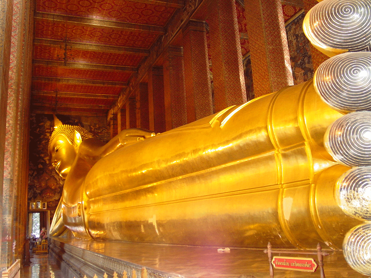 Admire the reclining Buddha at Viharn