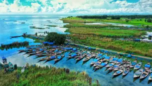 Relax by the breathtaking Chilika Lake, home to dolphins