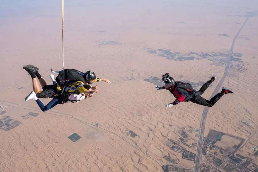 SkyDive Dubai: Tandem Skydiving at Desert Drop Zone + Free Burj Khalifa OR Desert Safari