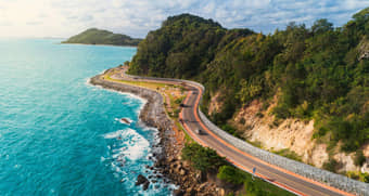 Enjoy a scenic journey along the Great Ocean Road, famed for its winding cliffs and breathtaking ocean views