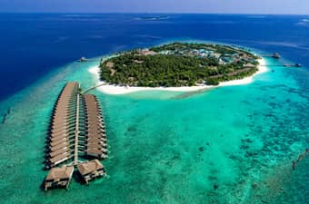 Marvel at the aerial view of Reethi Faru Resort, offering a luxurious escape