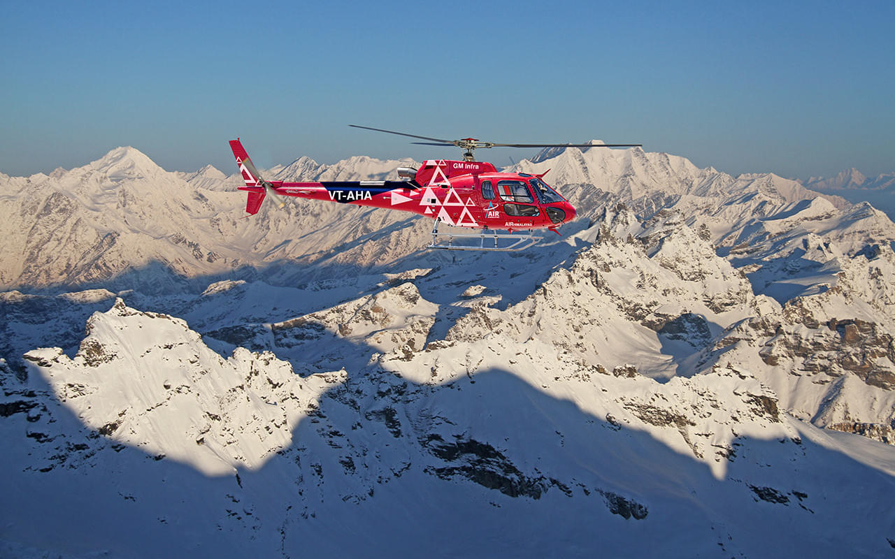 Soar to new heights and witness the breathtaking beauty of Manali from a helicopter