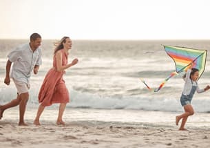 5q6jq626z231d6rcuef6eqzoe5ij happy family beach vacation and child flying kite 2022 12 07 23 14 13 utc 1 1