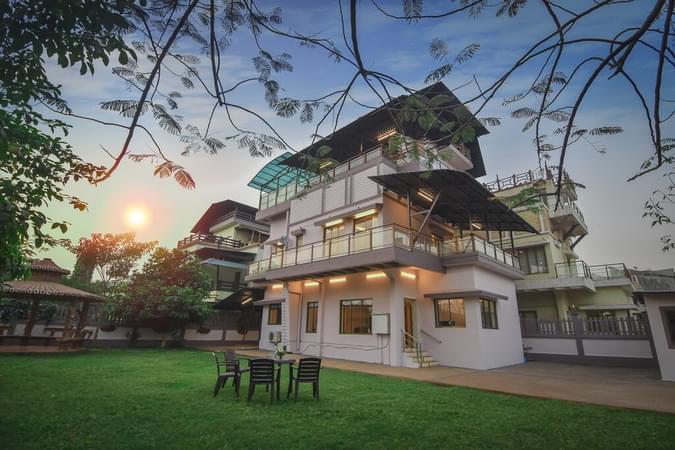 Outside View of villa with lush green garden