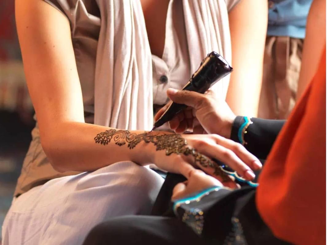 Relish the cultural art of henna painting.