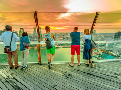 Visit the observation deck of Marina Bay and witness a lovely sunset